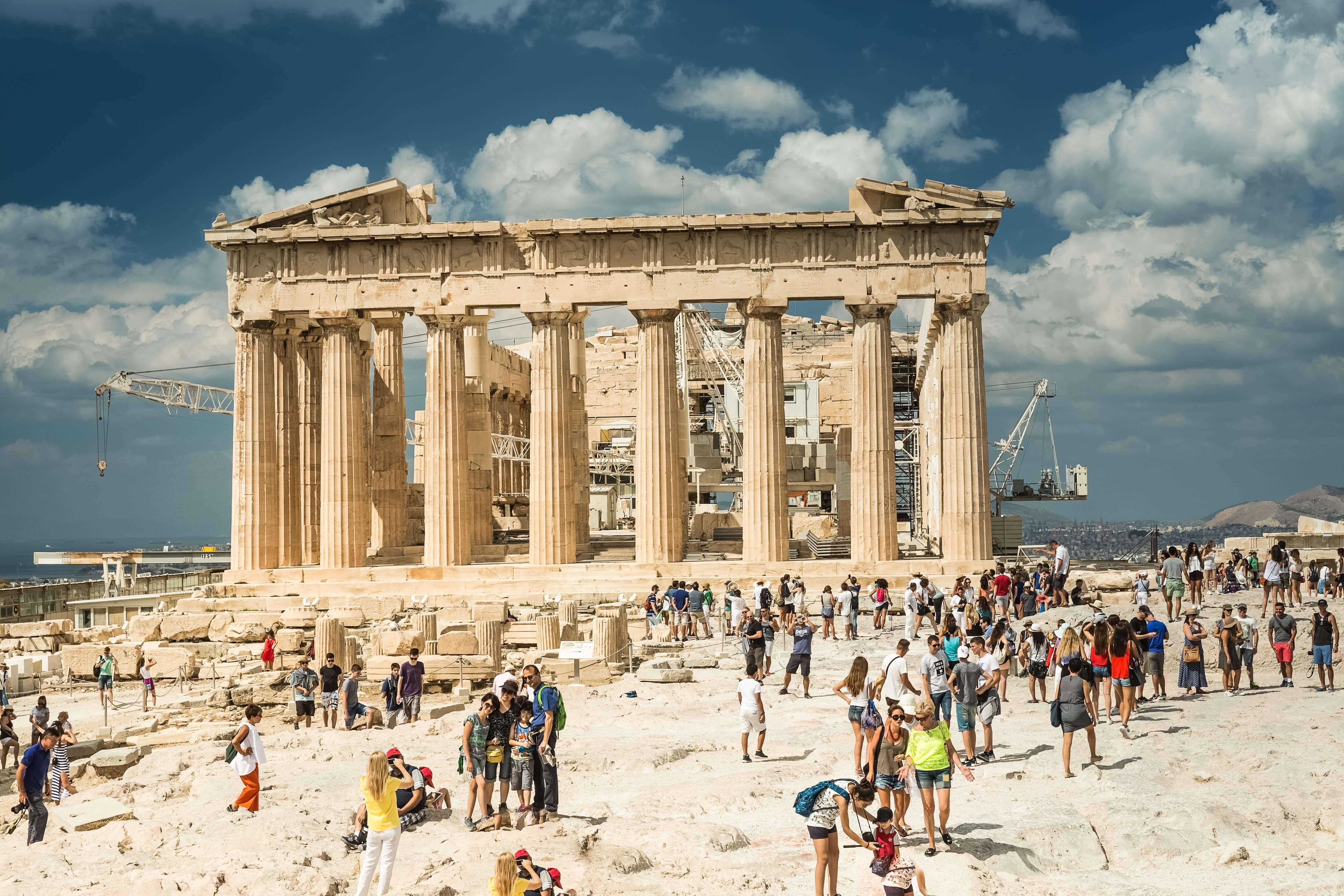 Many tourists around the Parthenon in Acropolis on a sunny day, Greece.